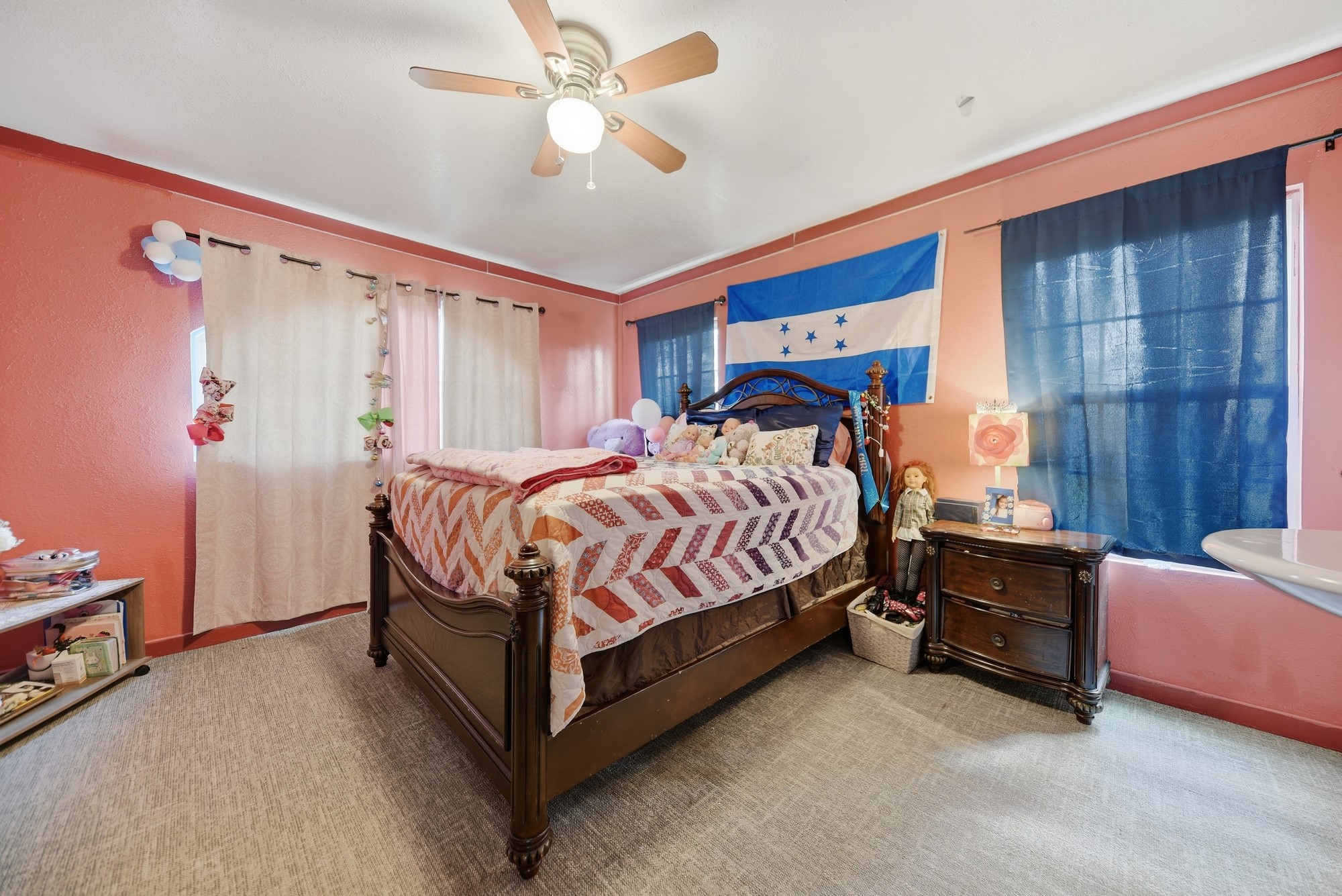 9524 Ferry Road Bellville, TX 77418 - Photo 5 of 15 a bedroom with a bed and a chandelier