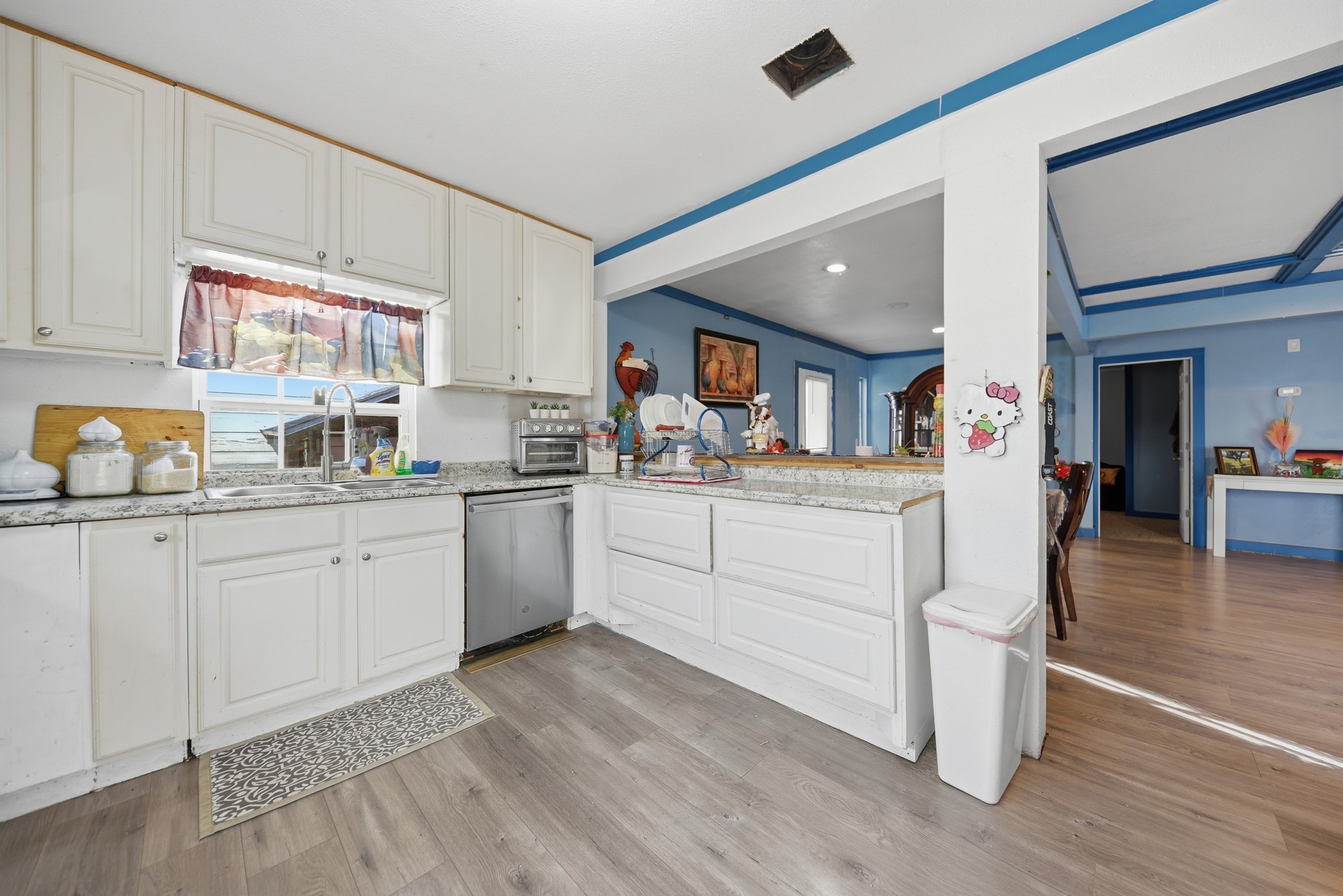 9524 Ferry Road Bellville, TX 77418 - Photo 8 of 15 a kitchen with white cabinets and sink