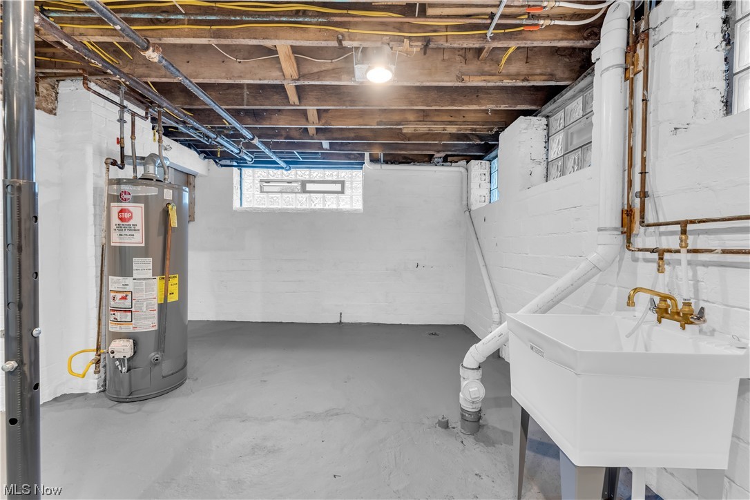 2640 Edgehill Road Cleveland, OH 44106 - Photo 32 of 35 Basement featuring water heater and sink