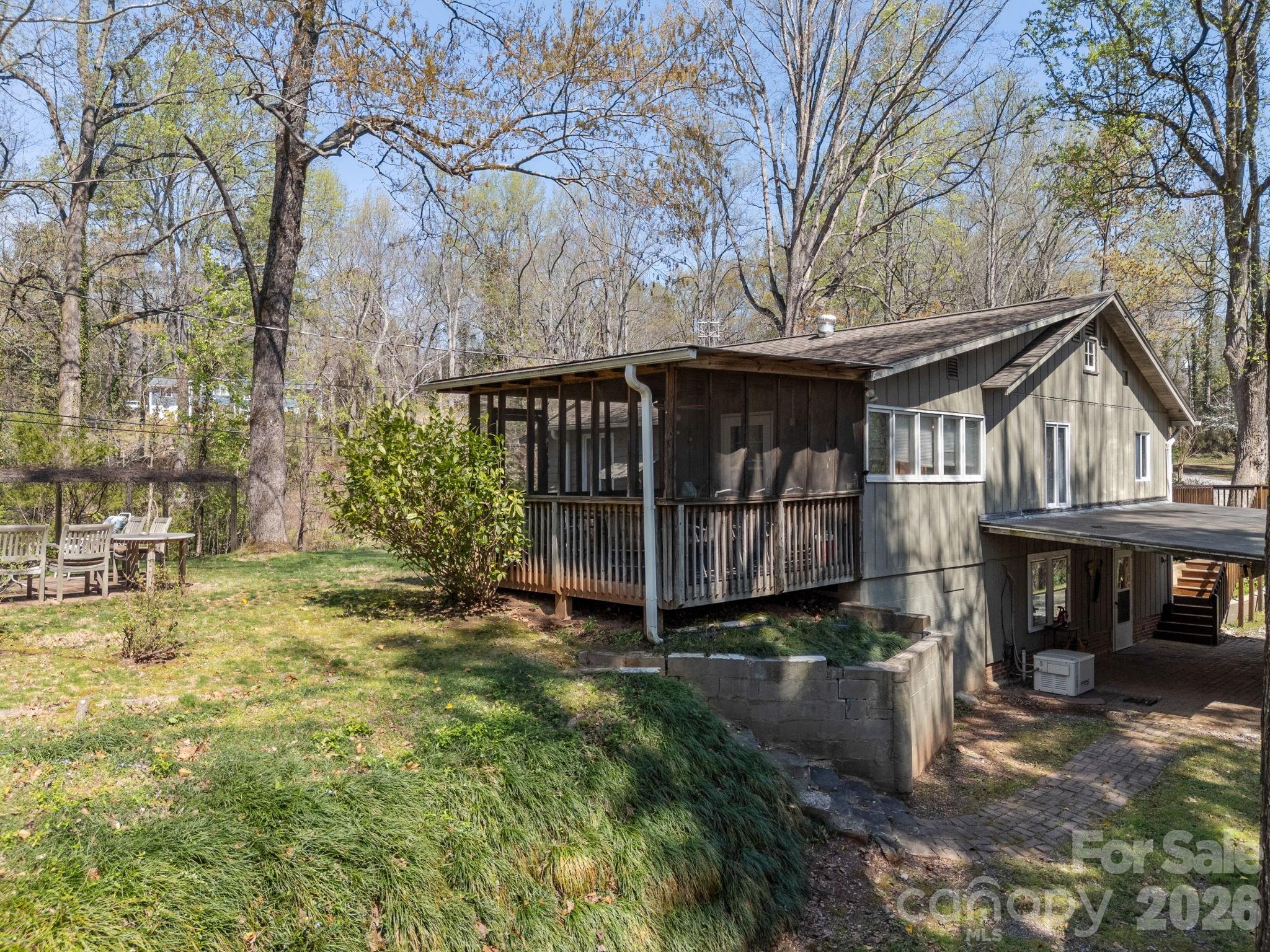 7 Rippy Road Tryon, NC 28782 - Photo 13 of 46 a view of a small house with yard and sitting area