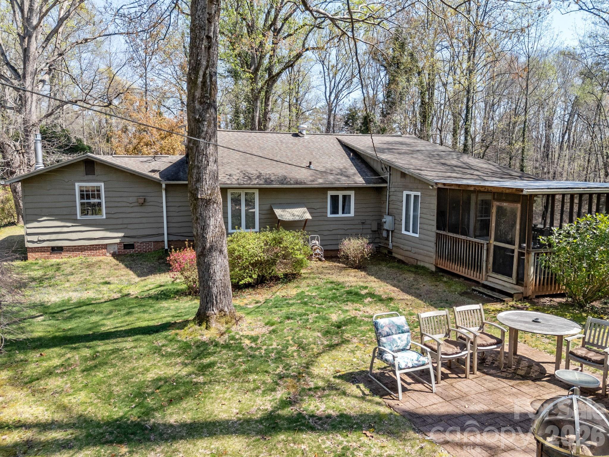 7 Rippy Road Tryon, NC 28782 - Photo 14 of 46 a backyard of a house with table and chairs