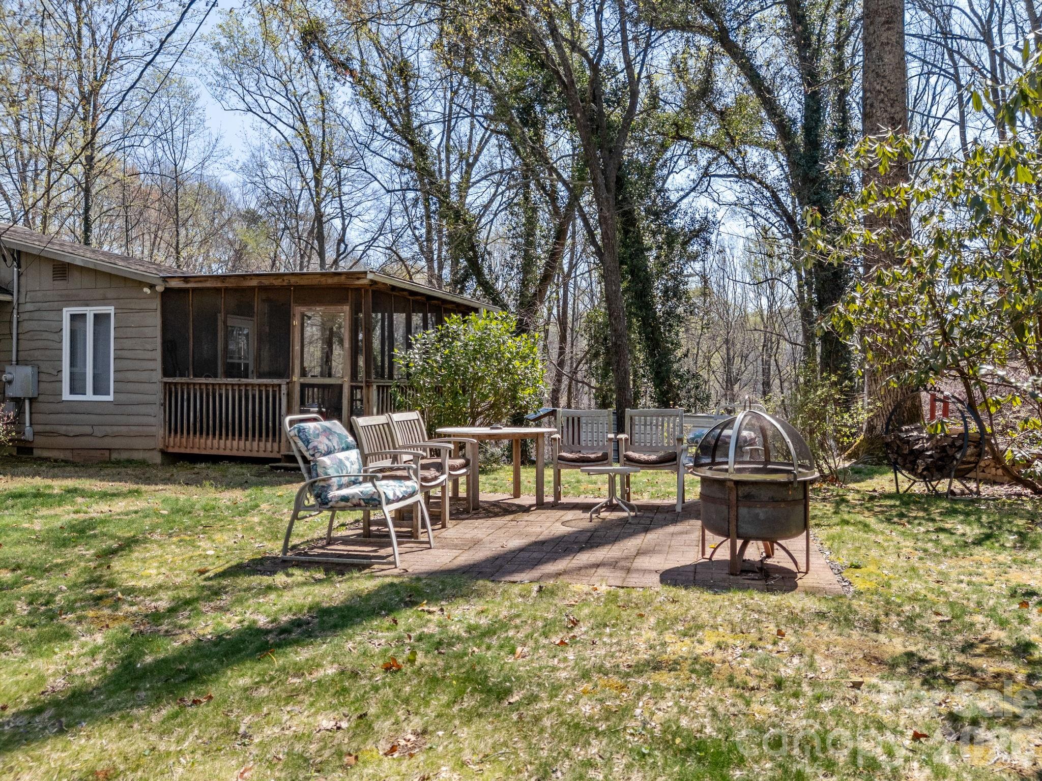 7 Rippy Road Tryon, NC 28782 - Photo 15 of 46 a view of a house with backyard and sitting area