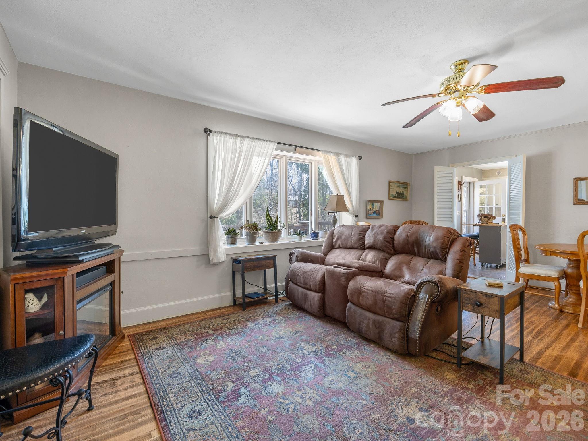 7 Rippy Road Tryon, NC 28782 - Photo 20 of 46 a living room with furniture and a flat screen tv