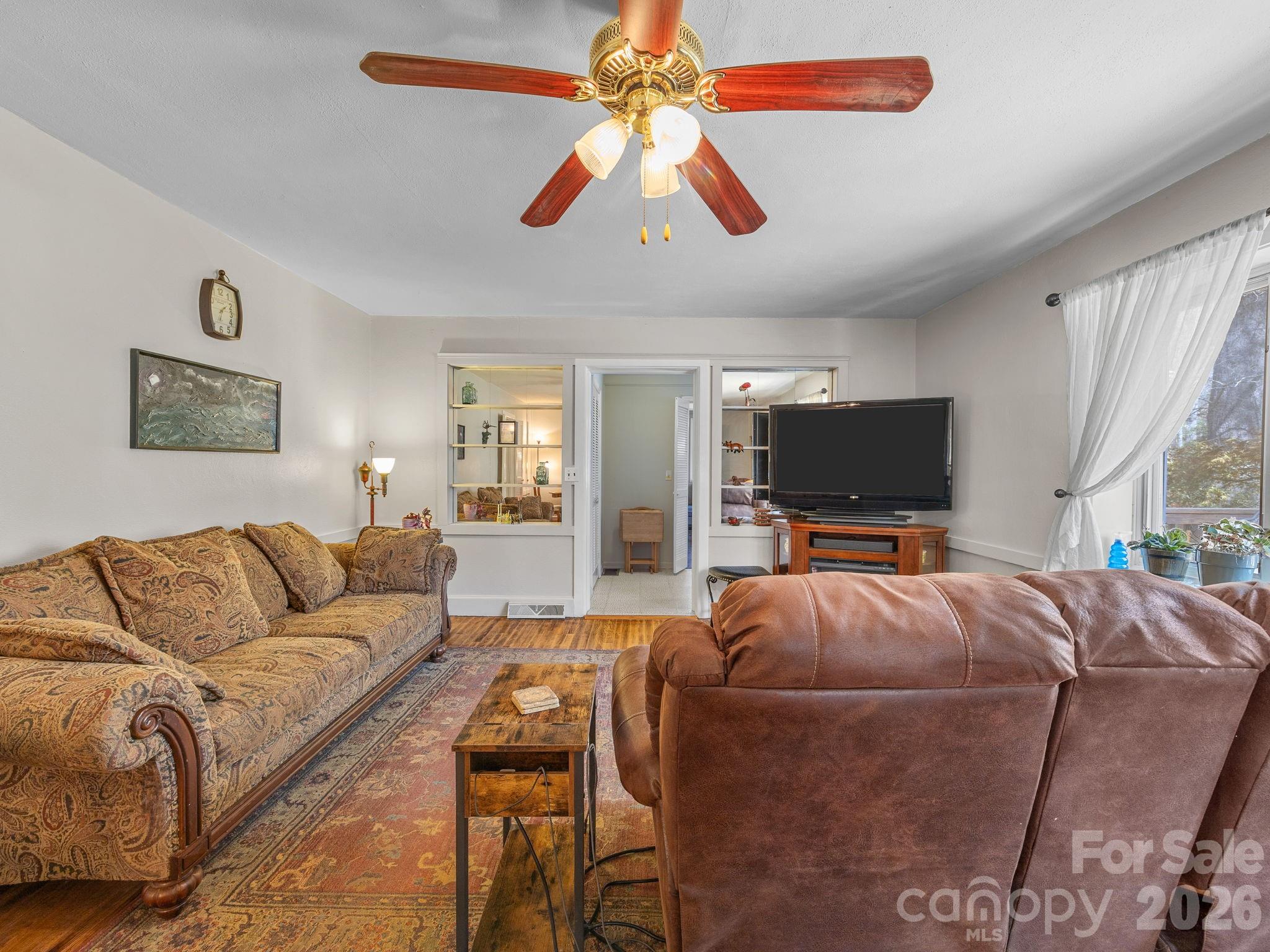 7 Rippy Road Tryon, NC 28782 - Photo 22 of 46 a living room with furniture and a flat screen tv