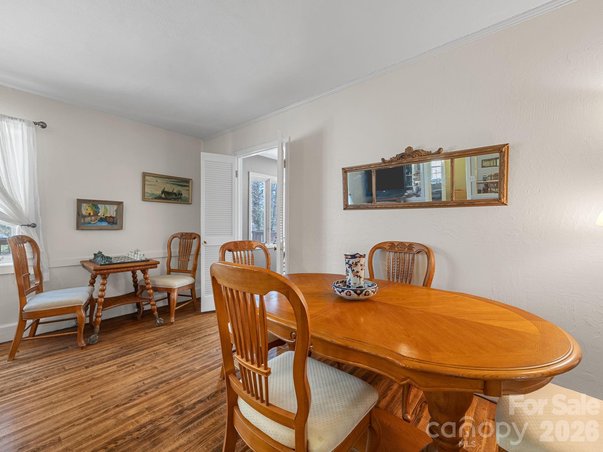 7 Rippy Road Tryon, NC 28782 - Photo 23 of 46 a view of a dining room with furniture and wooden floor