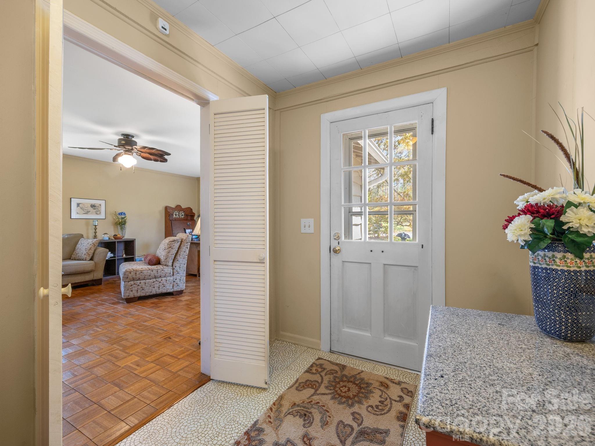 7 Rippy Road Tryon, NC 28782 - Photo 26 of 46 a living room with furniture and a potted plant