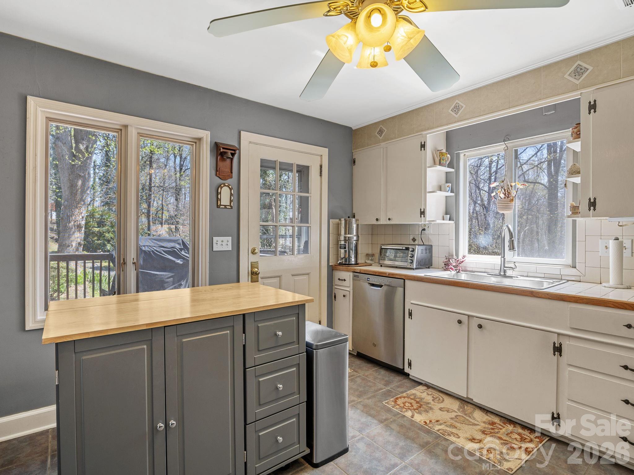 7 Rippy Road Tryon, NC 28782 - Photo 28 of 46 a kitchen with a sink and large windows