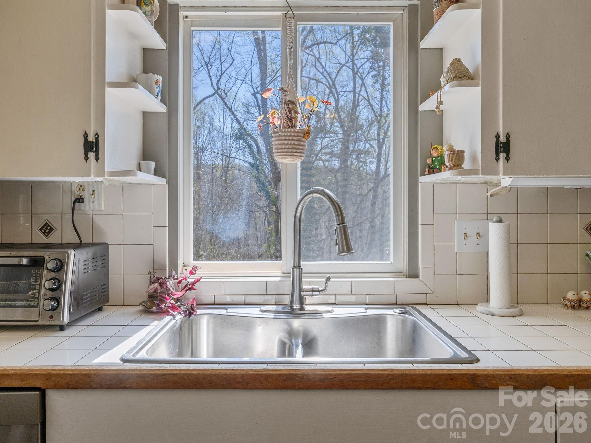 7 Rippy Road Tryon, NC 28782 - Photo 29 of 46 a kitchen with a sink and a mirror