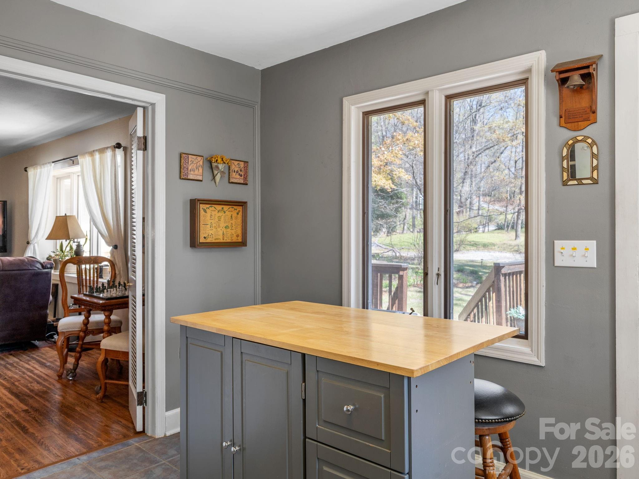 7 Rippy Road Tryon, NC 28782 - Photo 32 of 46 a kitchen with a stove a refrigerator a sink dishwasher with wooden cabinets and dining table