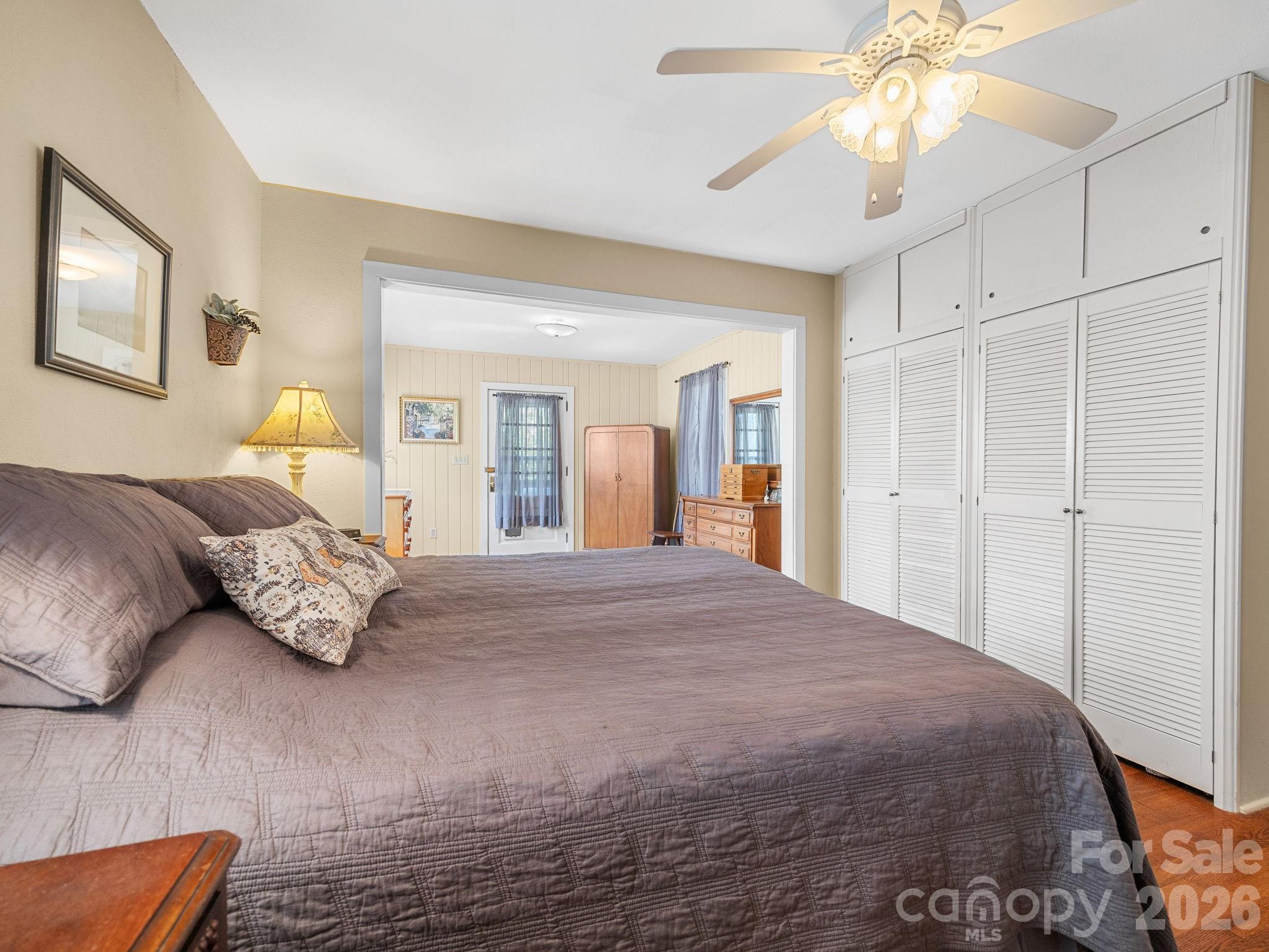 7 Rippy Road Tryon, NC 28782 - Photo 34 of 46 a bedroom with a bed and wooden floor
