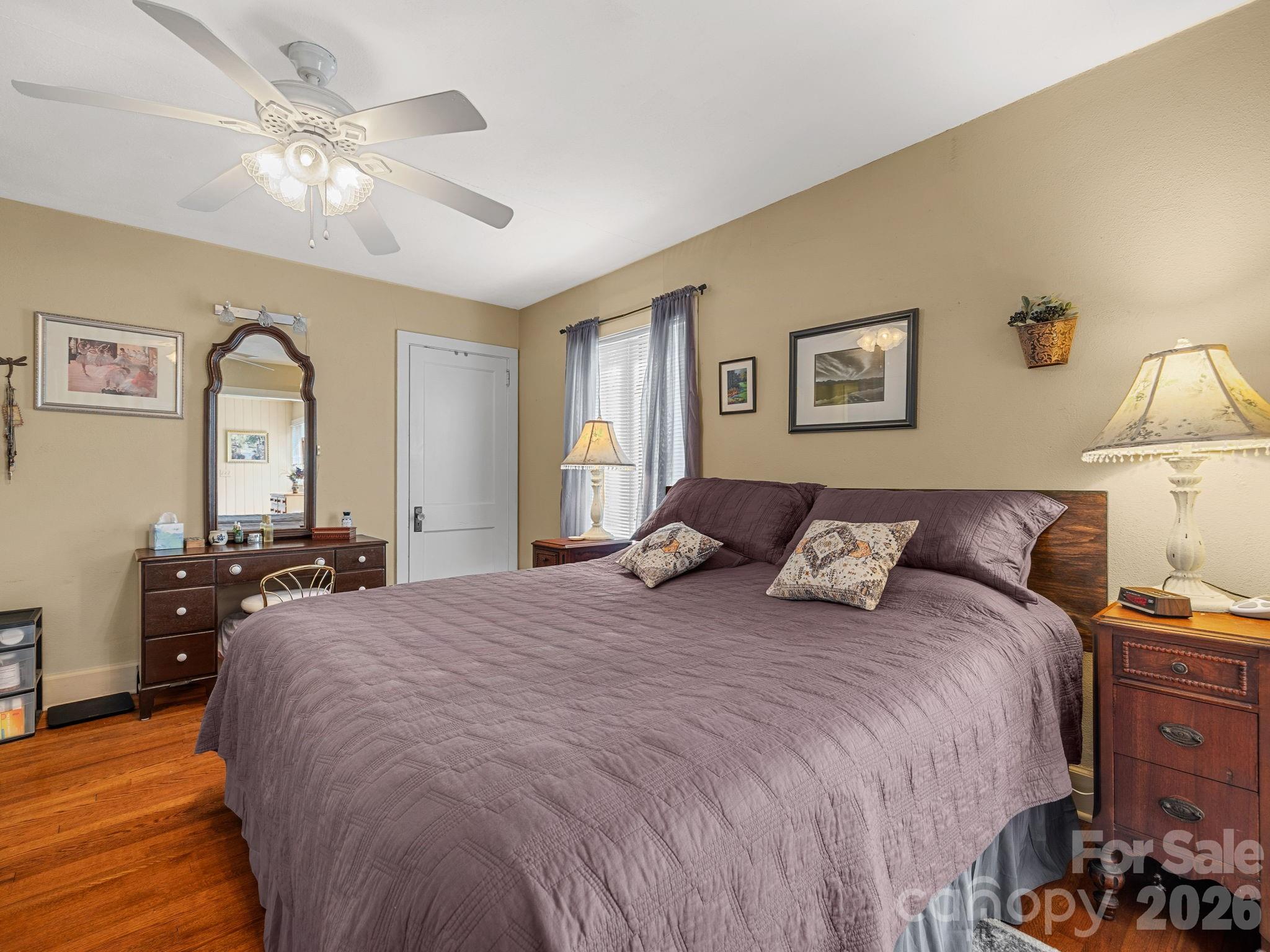 7 Rippy Road Tryon, NC 28782 - Photo 35 of 46 a bed room with a bed and a chandelier