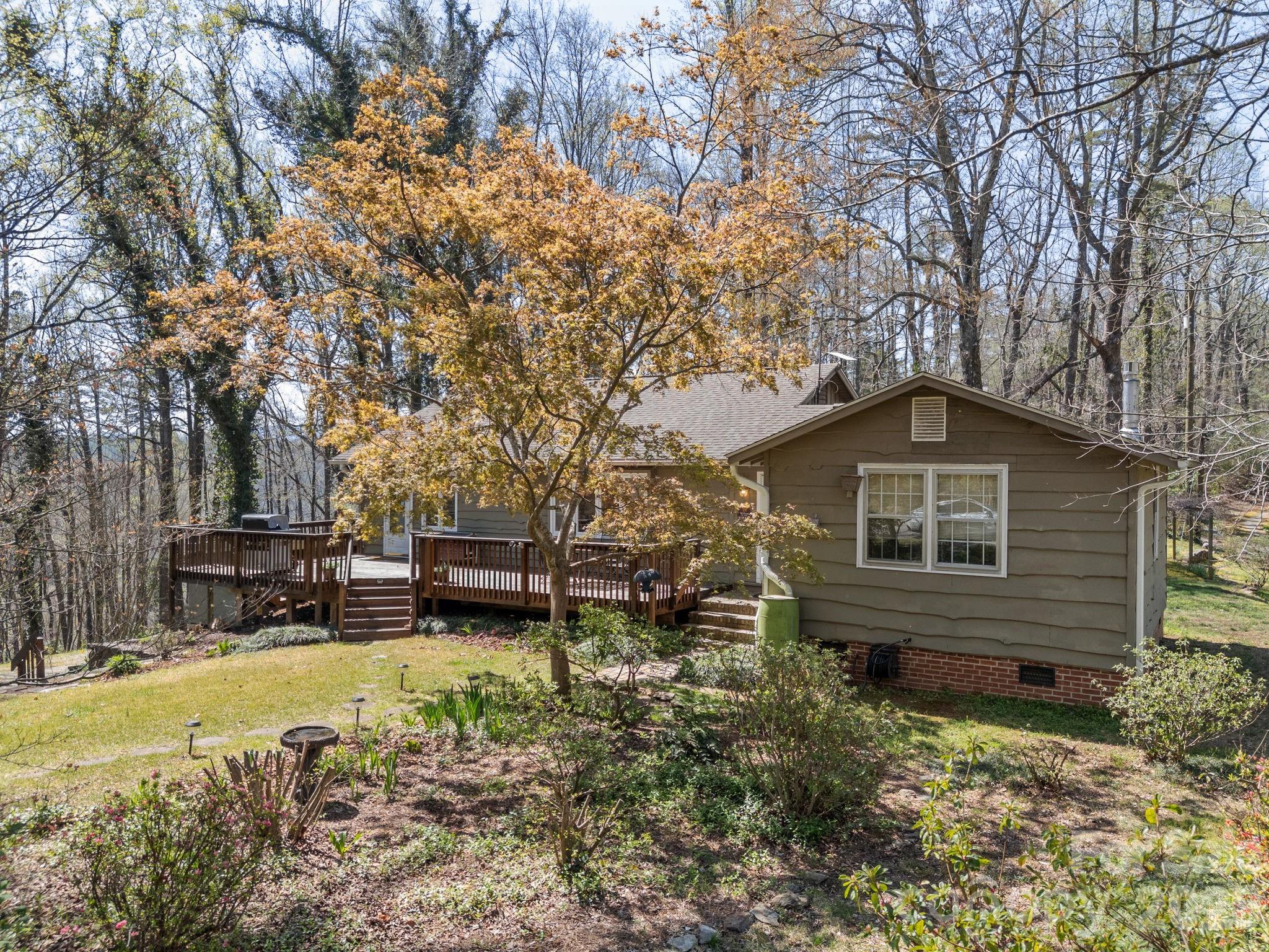 7 Rippy Road Tryon, NC 28782 - Photo 4 of 46 a front view of a house with a yard