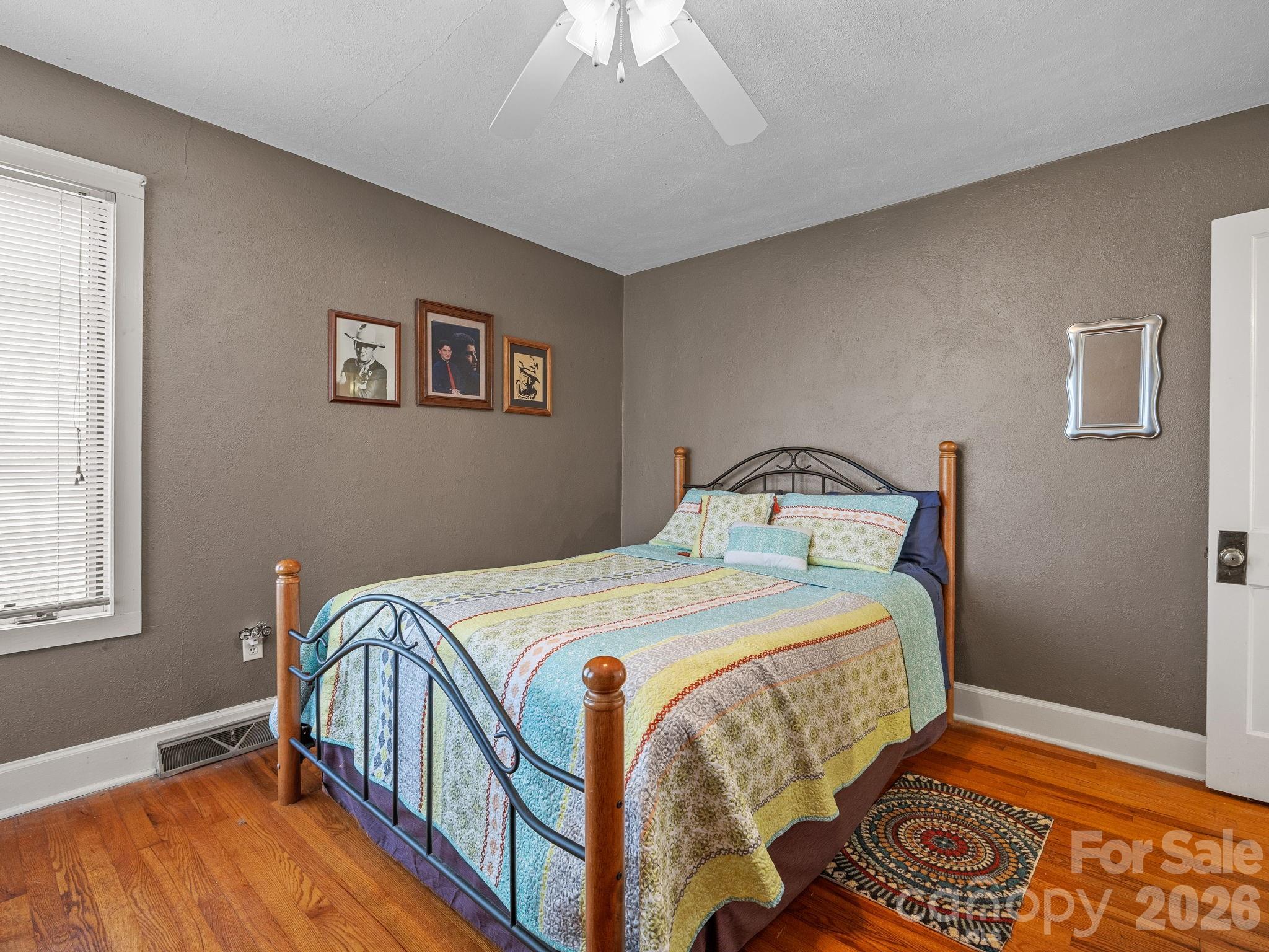 7 Rippy Road Tryon, NC 28782 - Photo 42 of 46 a bedroom with a bed and wooden floor