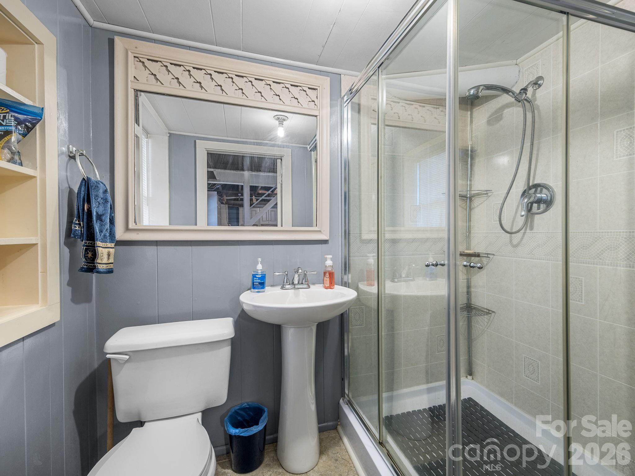 7 Rippy Road Tryon, NC 28782 - Photo 45 of 46 a bathroom with a sink toilet and shower