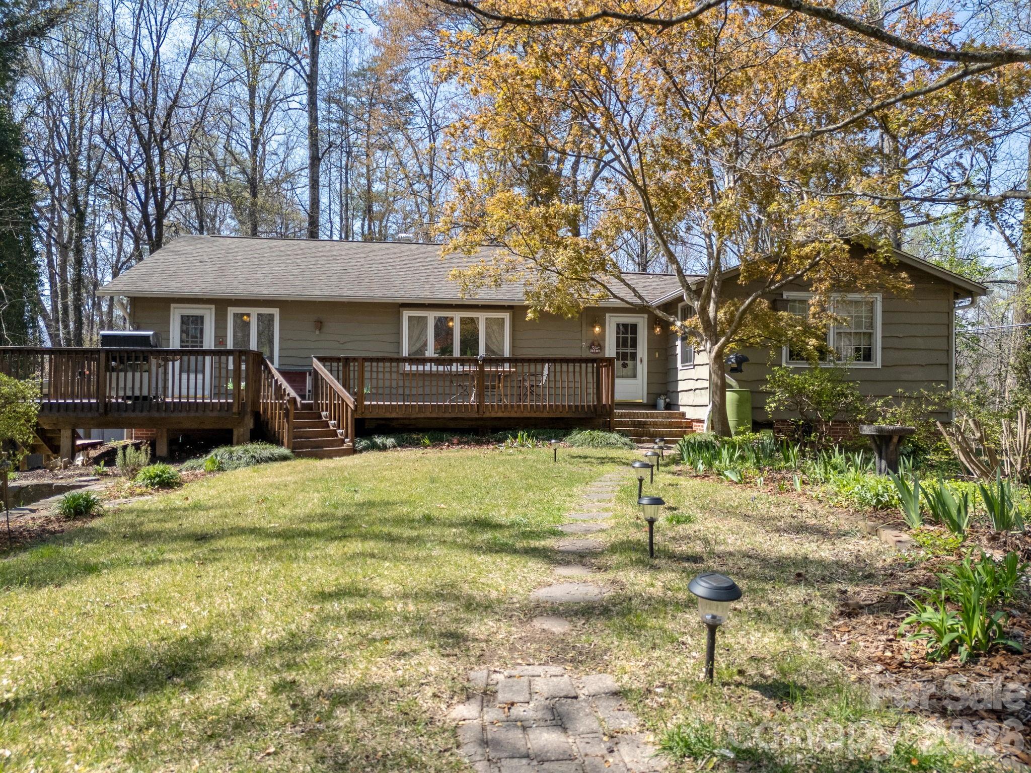 7 Rippy Road Tryon, NC 28782 - Photo 5 of 46 a front view of a house with a yard