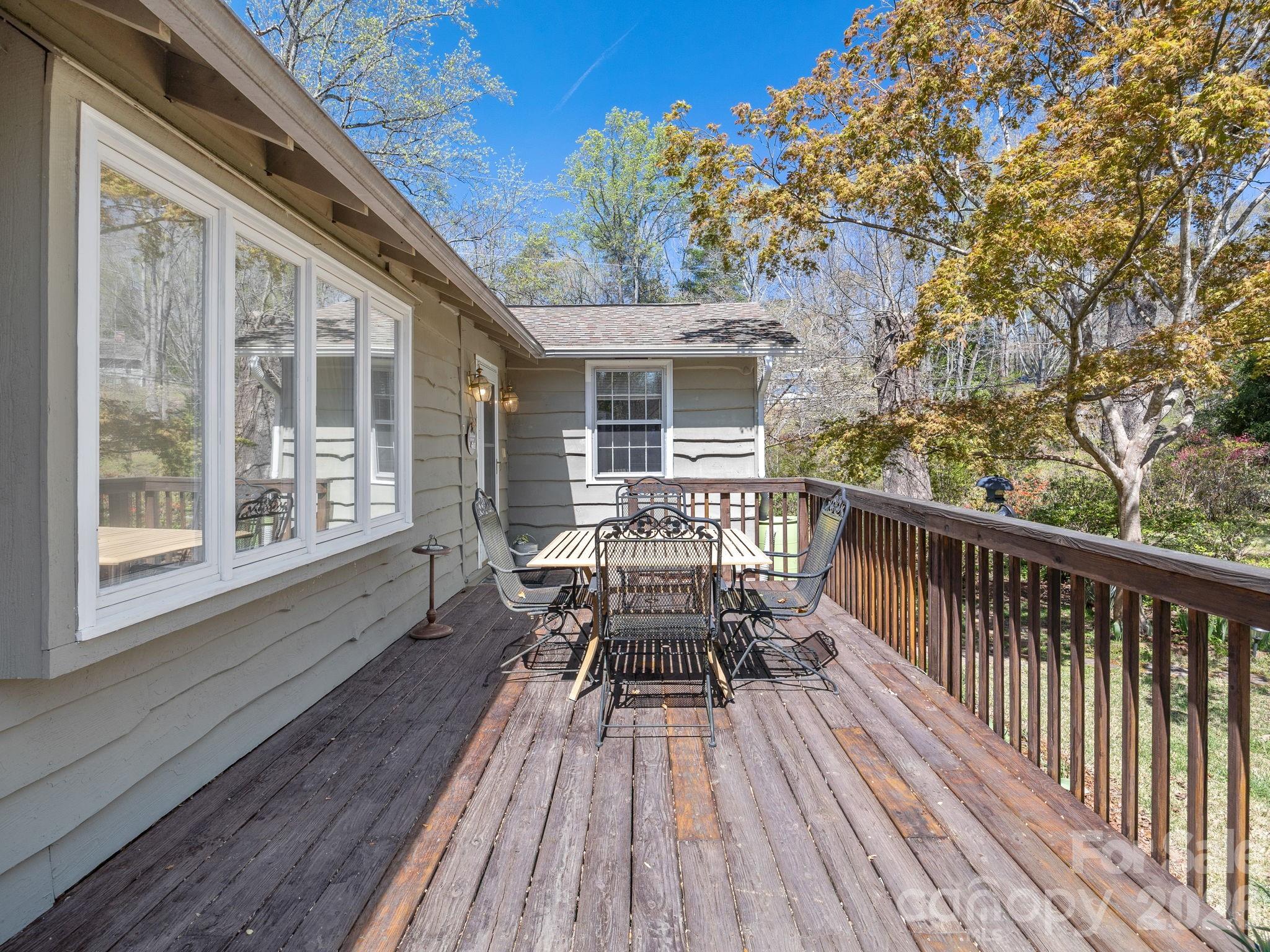 7 Rippy Road Tryon, NC 28782 - Photo 7 of 46 a view of balcony with chairs and wooden fence