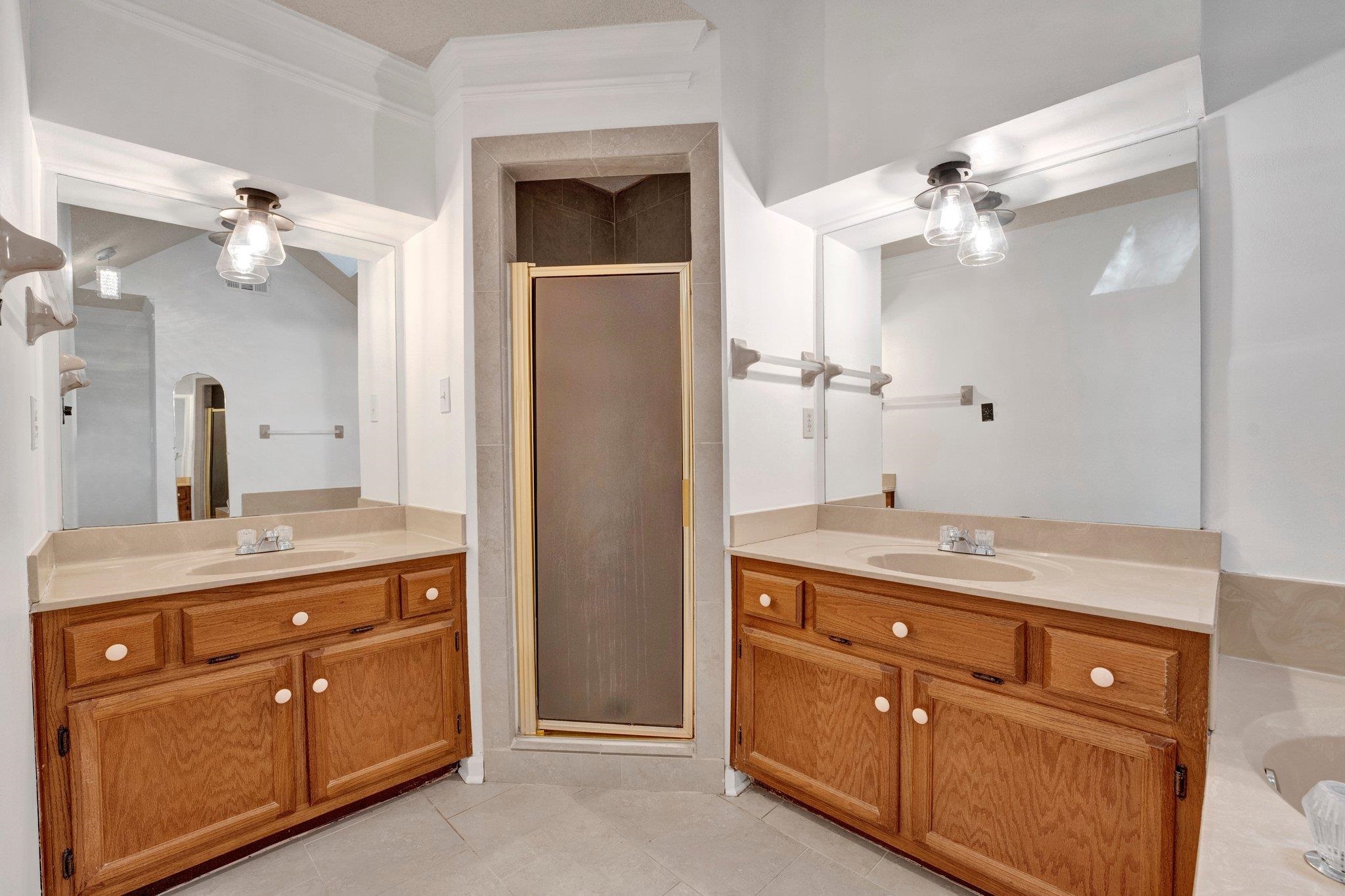 3656 Beaver Run Drive Collierville, TN 38017 - Photo 13 of 24 a bathroom with a granite countertop sink a light fixture and a mirror