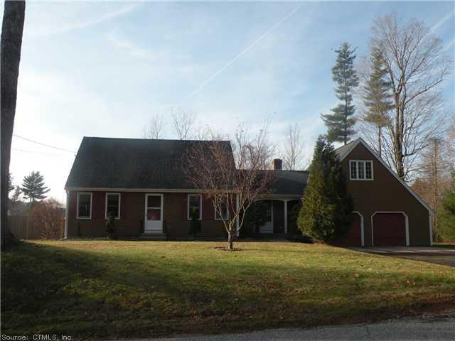 58 Senexet Road Putnam, CT 06260 - Photo 1 of 1 a front view of a house with a yard and garage