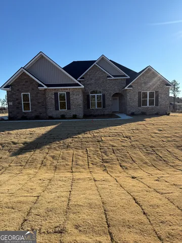 a front view of a house with yard