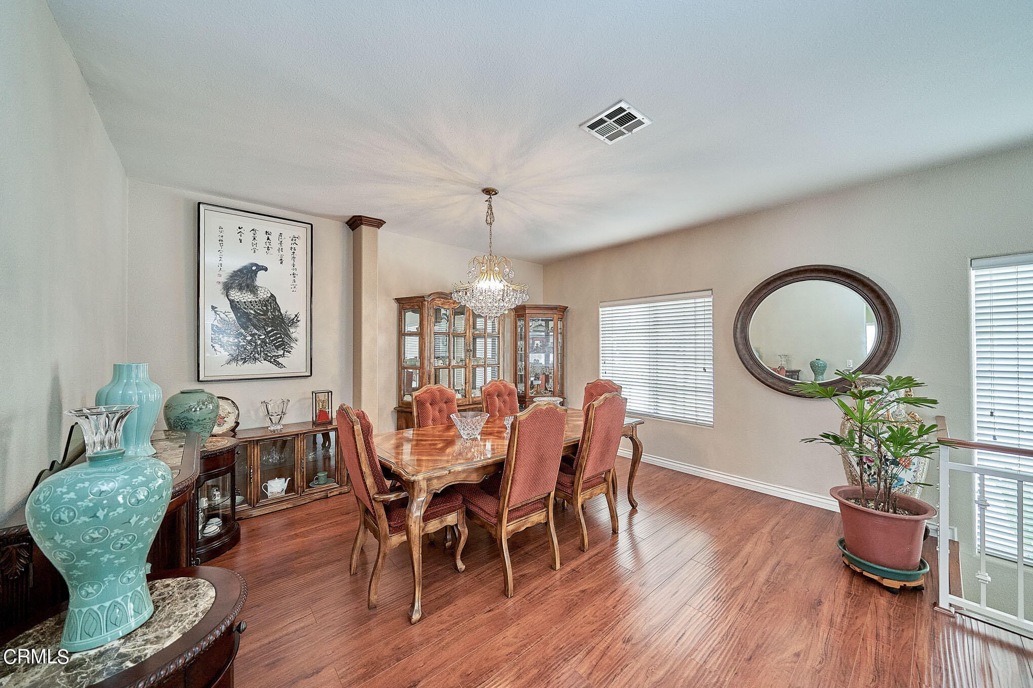 4516 Ramsdell Avenue, Unit 124 La Crescenta, CA 91214 - Photo 3 of 5 a dining room with furniture a potted plant and wooden floor