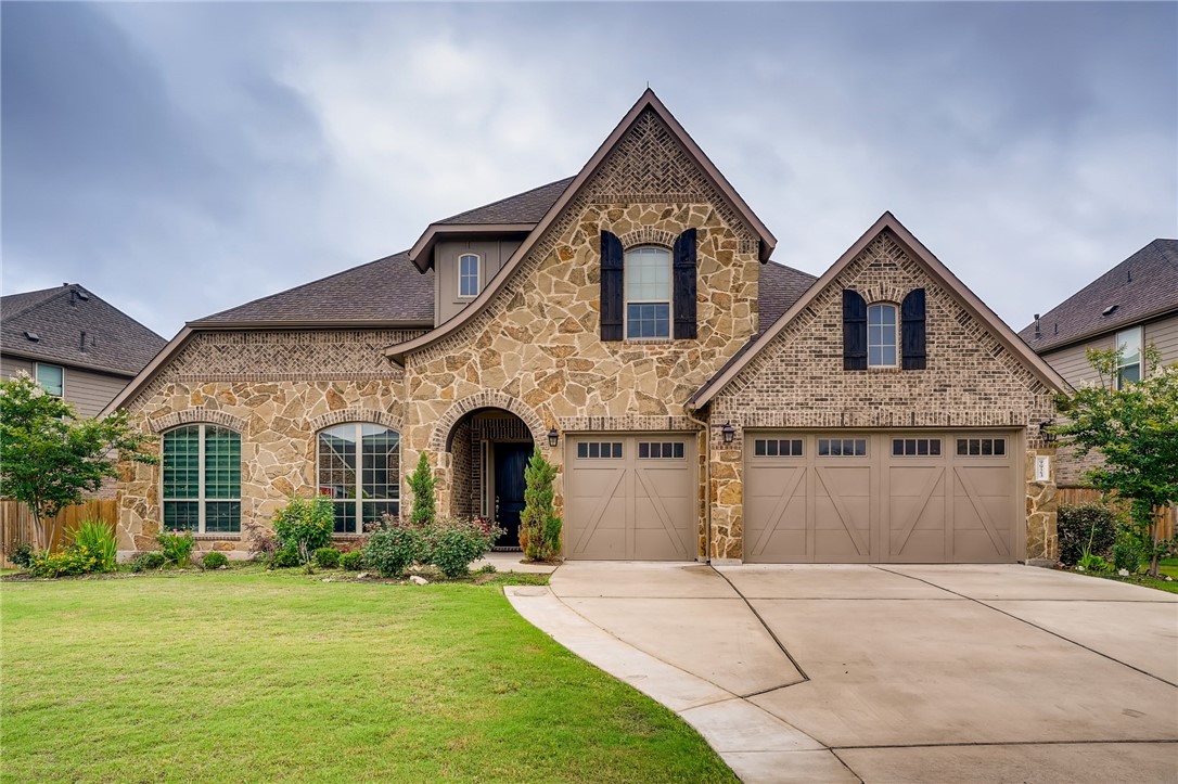 9923 Lavon Bend Austin, TX 78717 - Photo 1 of 1 a front view of a house with a yard and garage