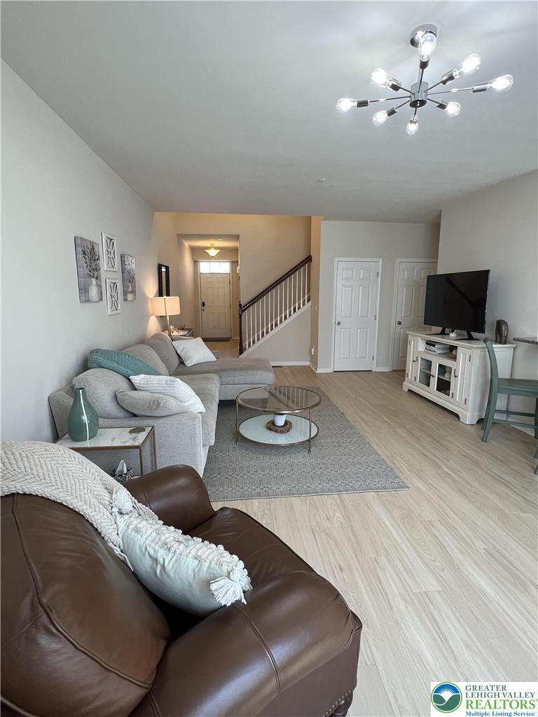 5380 Jutland Road Allentown, PA 18104 - Photo 5 of 27 Blonde wood flooring creates a welcoming ambiance in this well-lit living area.