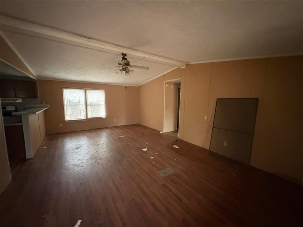 74 Davis Road Dawsonville, GA 30534 - Photo 4 of 6 an empty room with wooden floor and windows