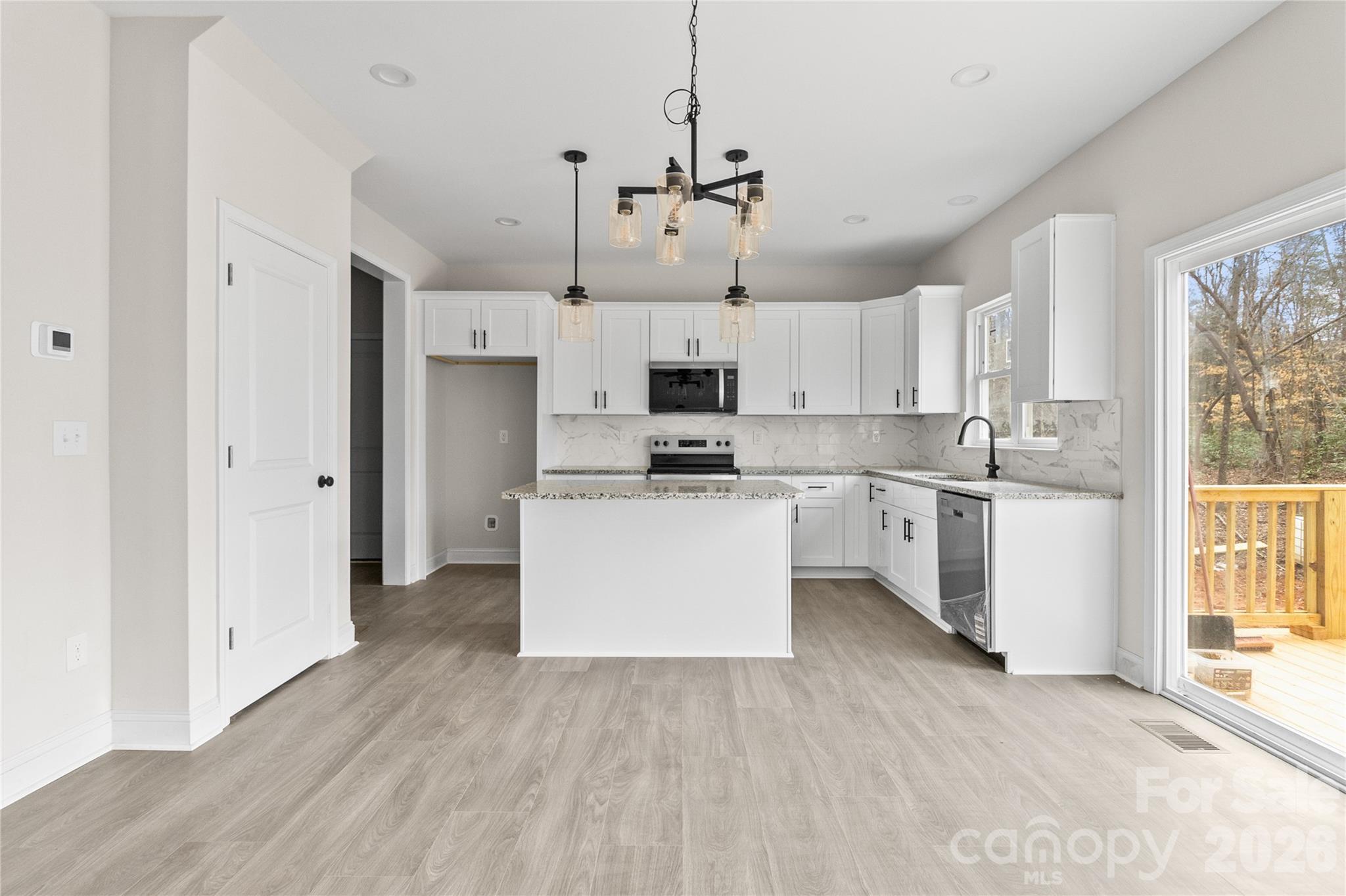 3692 Shannon Loop Denver, NC 28037 - Photo 13 of 47 a view of kitchen with white cabinets and stainless steel appliances