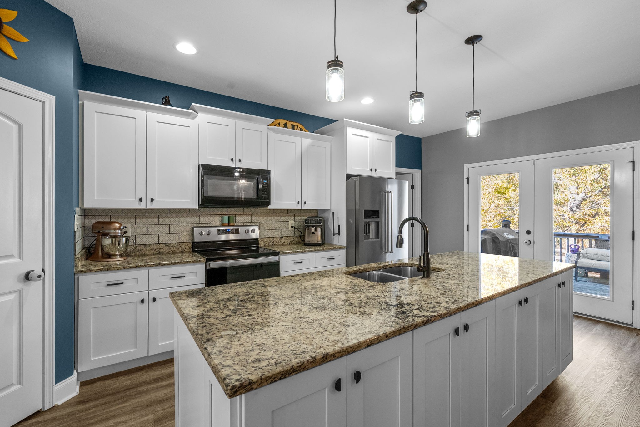 4553 Cumberland City Road Indian Mound, TN 37079 - Photo 12 of 44 a kitchen with stainless steel appliances granite countertop a sink refrigerator and microwave