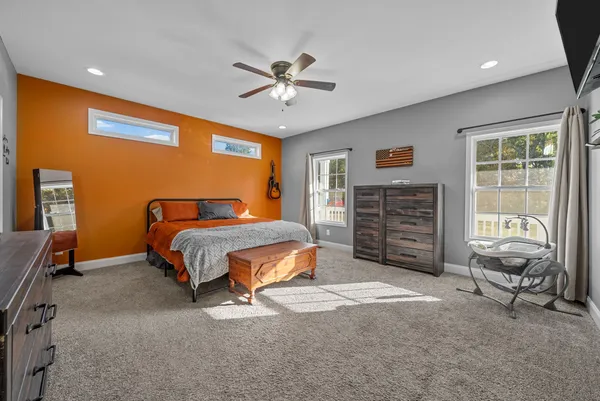 a bedroom with a bed and furniture