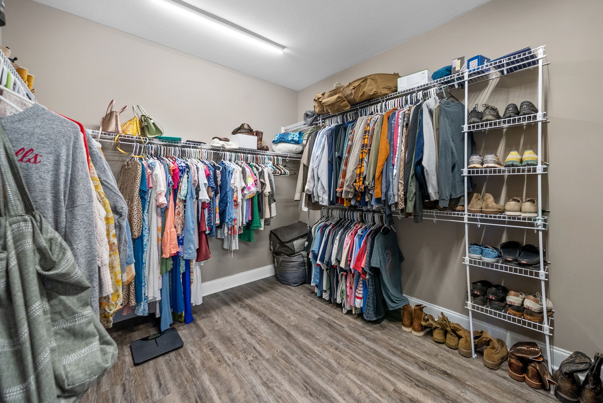 4553 Cumberland City Road Indian Mound, TN 37079 - Photo 23 of 44 a view of walk in closet with clothes and shoes