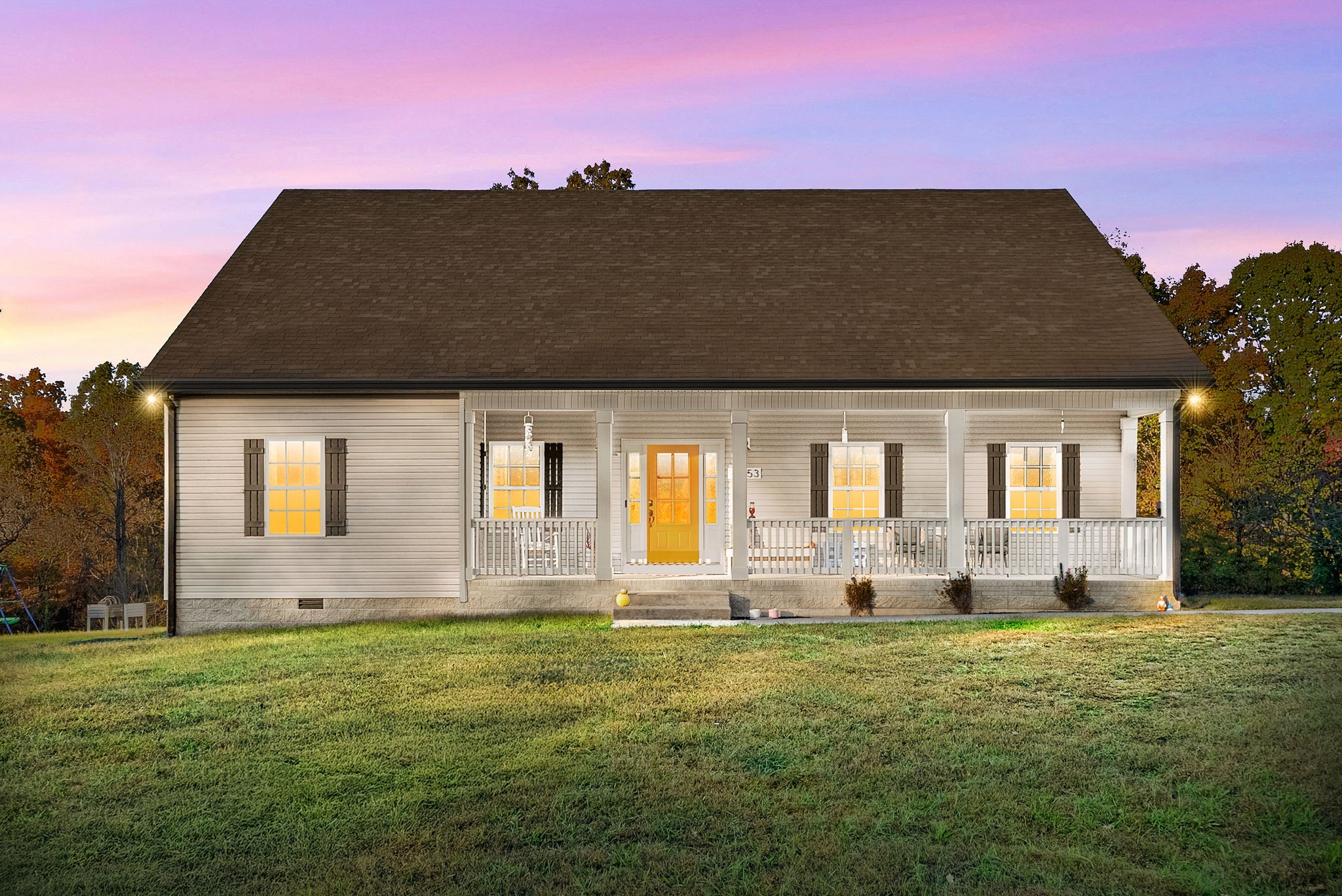 4553 Cumberland City Road Indian Mound, TN 37079 - Photo 3 of 44 a backyard of a house with table and chairs