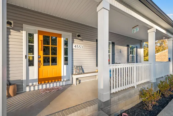 a front view of a house with a porch