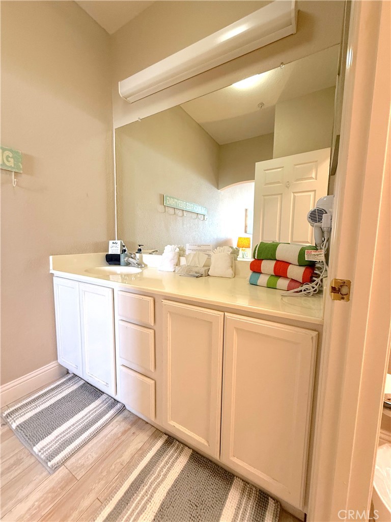444 Pier Avenue, Unit 44 Oceano, CA 93445 - Photo 11 of 17 a bathroom with a sink and a mirror