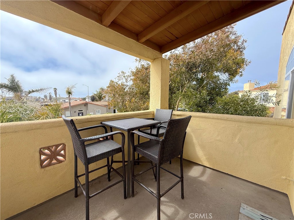 444 Pier Avenue, Unit 44 Oceano, CA 93445 - Photo 12 of 17 a view of outdoor space with table and chairs