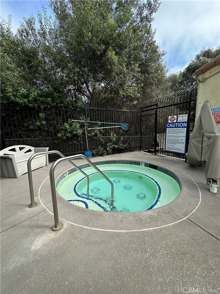 444 Pier Avenue, Unit 44 Oceano, CA 93445 - Photo 14 of 17 a small pool with lawn chairs and a yard
