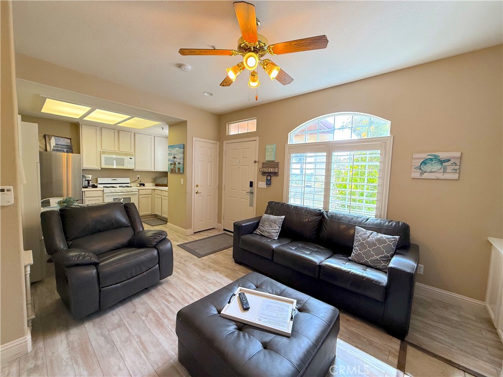 444 Pier Avenue, Unit 44 Oceano, CA 93445 - Photo 5 of 17 a living room with furniture and a large window