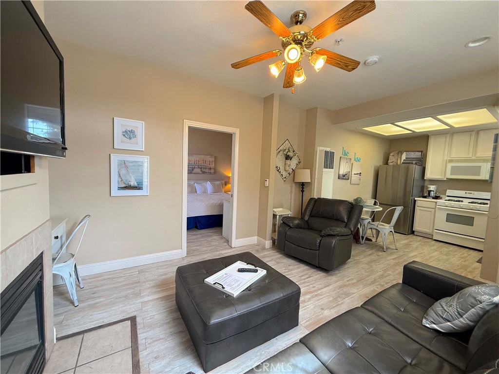 444 Pier Avenue, Unit 44 Oceano, CA 93445 - Photo 6 of 17 a living room with furniture and a flat screen tv