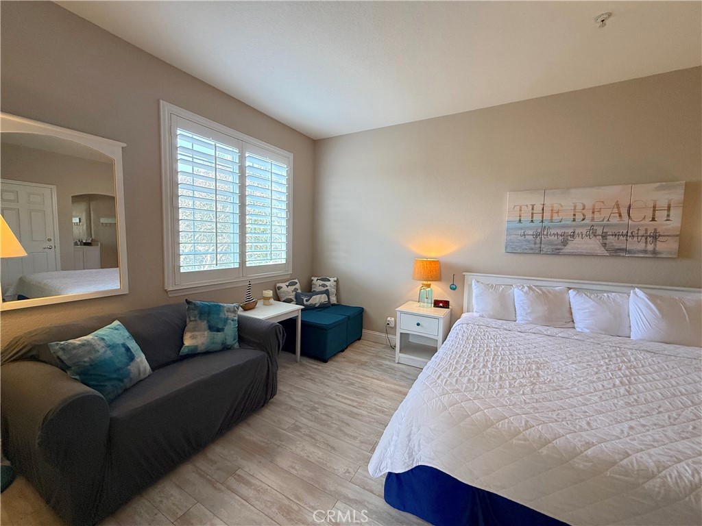 444 Pier Avenue, Unit 44 Oceano, CA 93445 - Photo 7 of 17 a bedroom with a bed and a couch