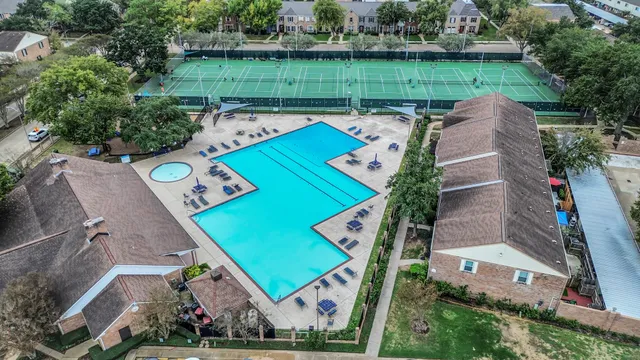 an aerial view of a house with a big yard