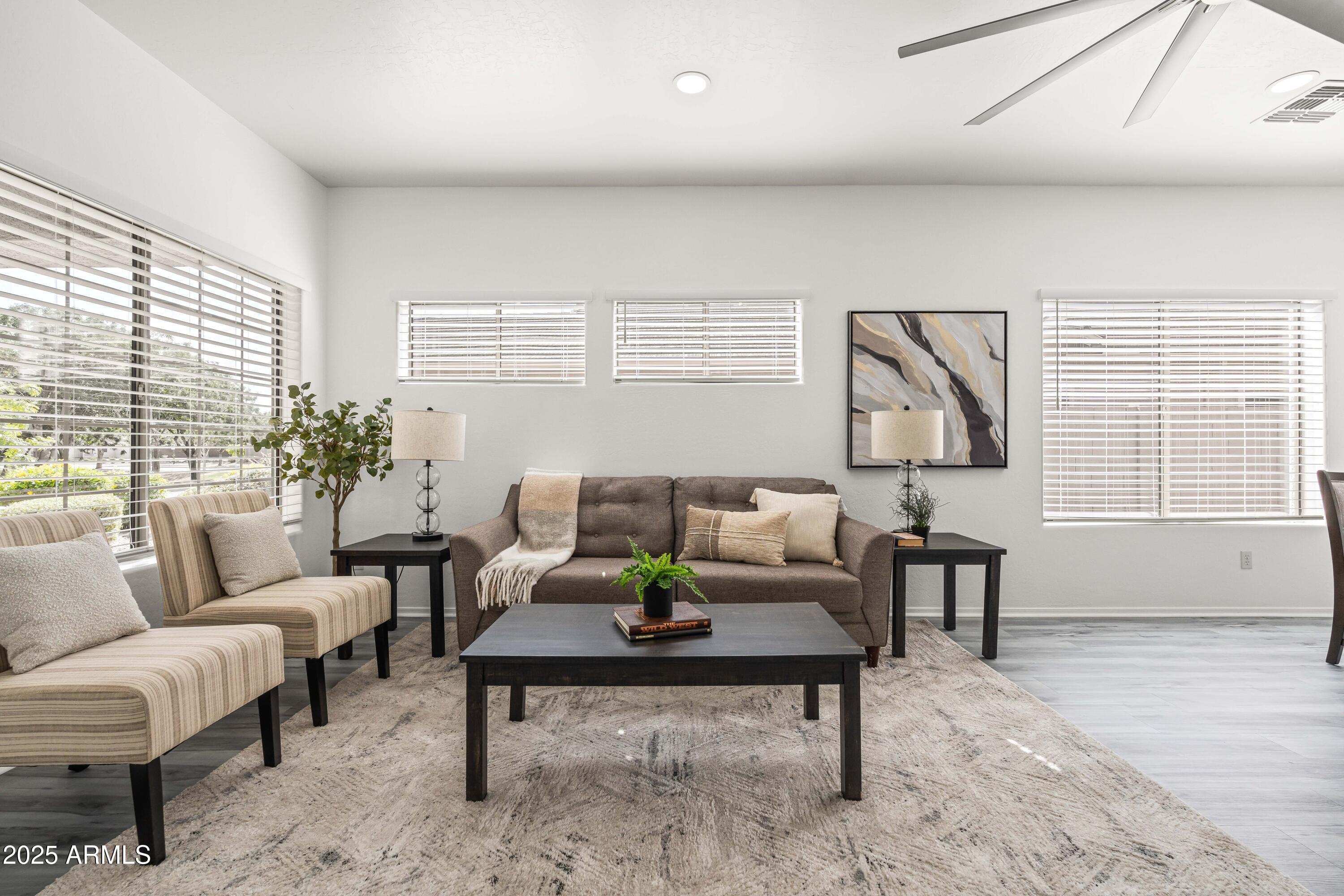 4140 East Claxton Avenue Gilbert, AZ 85297 - Photo 16 of 112 a living room with furniture and a window