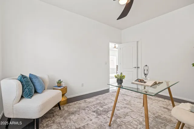 a bed room with a bed and a chair