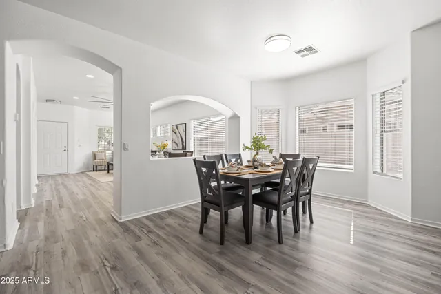 a large bathroom with a large tub sink and mirror