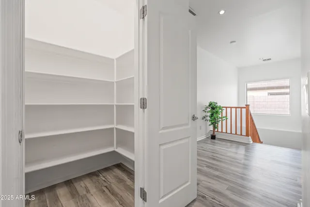 an empty room with a empty space & window