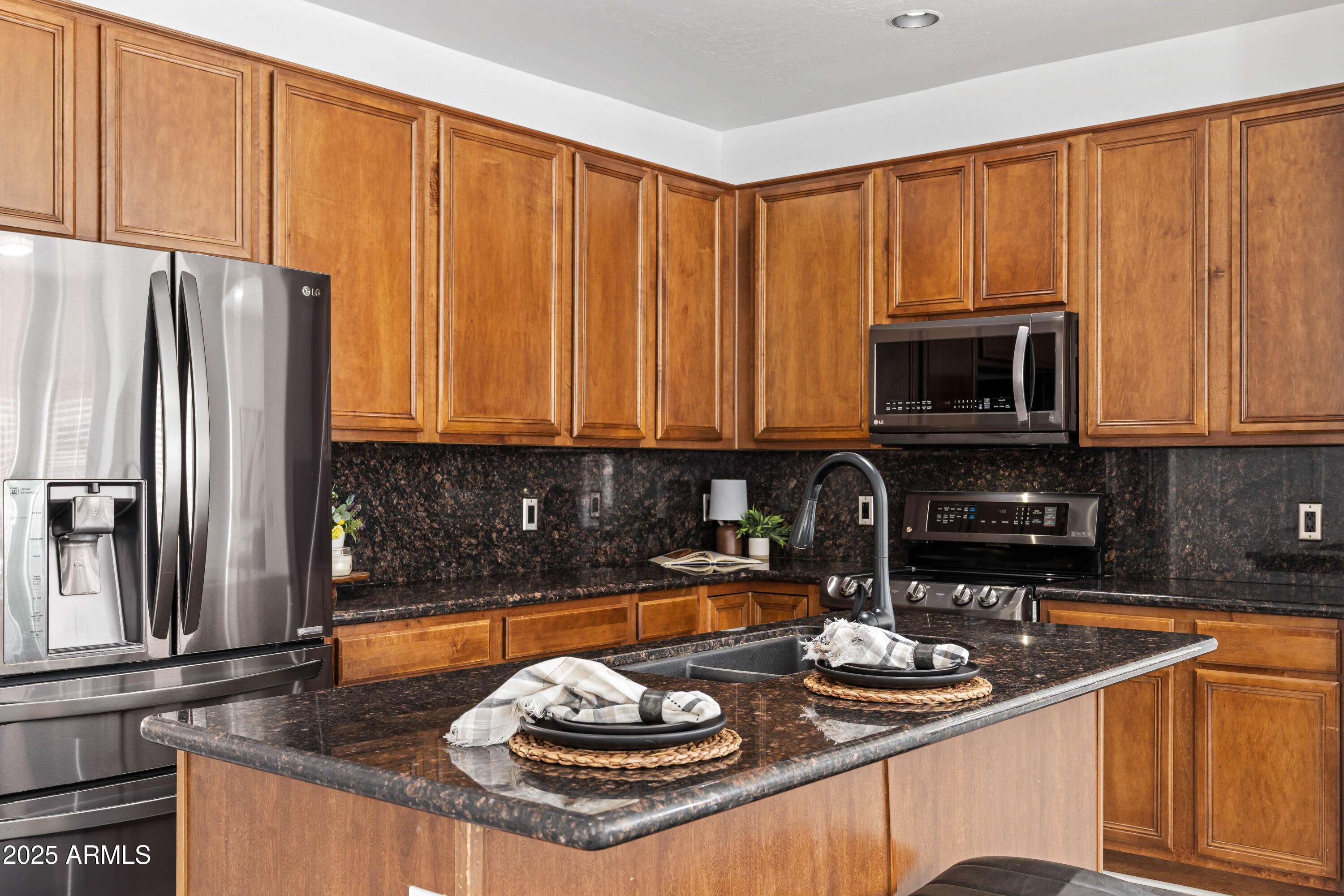 4140 East Claxton Avenue Gilbert, AZ 85297 - Photo 3 of 112 a kitchen with a sink a stove and cabinets