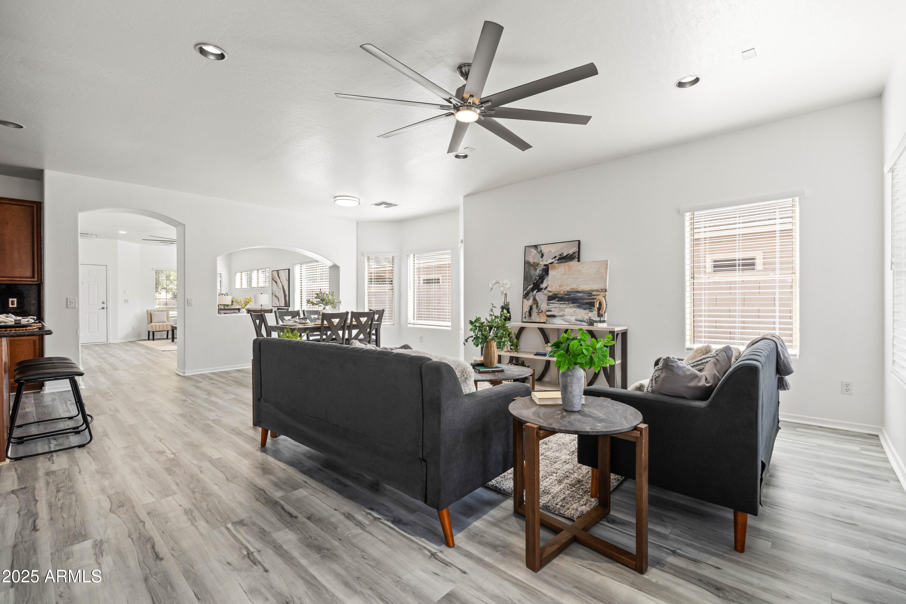 4140 East Claxton Avenue Gilbert, AZ 85297 - Photo 33 of 112 a living room with furniture a window and wooden floor