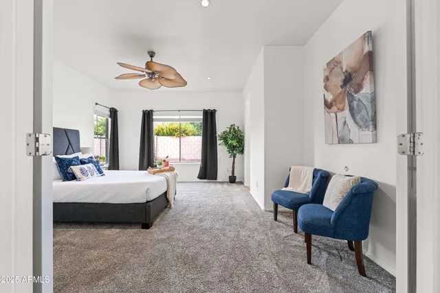 a view of an house with backyard space and balcony