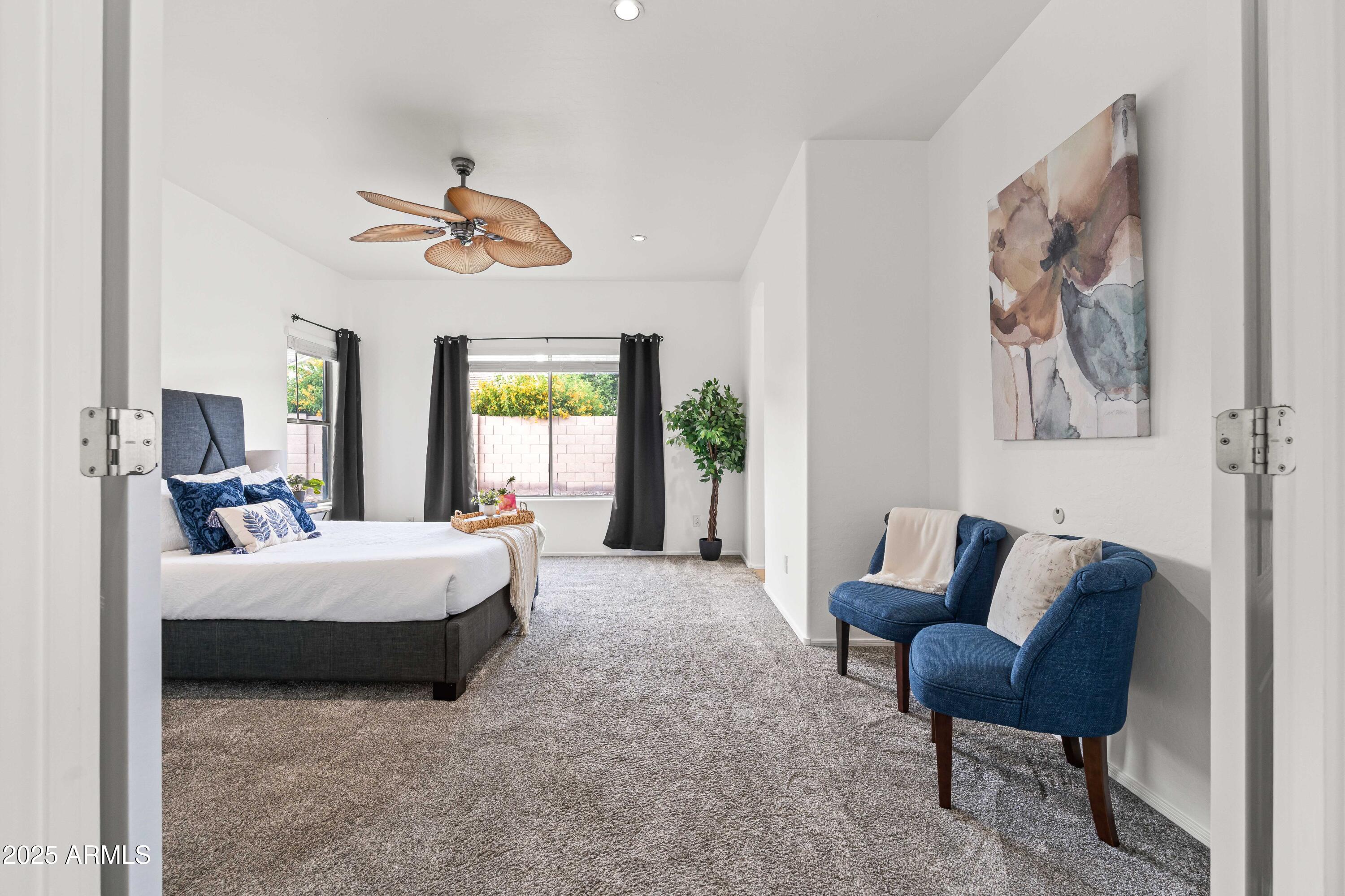 4140 East Claxton Avenue Gilbert, AZ 85297 - Photo 34 of 112 a bed room with a bed and a chair