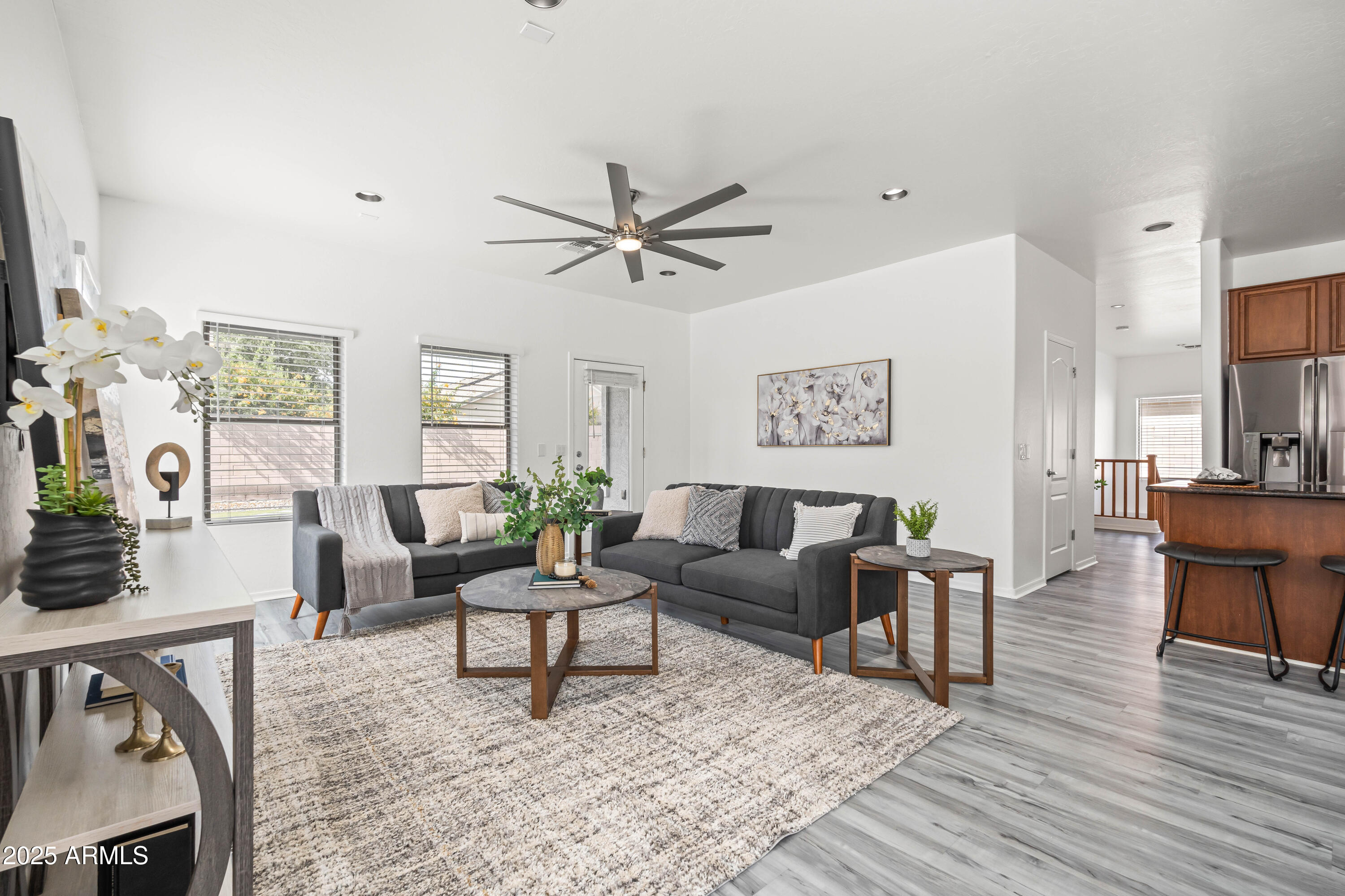 4140 East Claxton Avenue Gilbert, AZ 85297 - Photo 4 of 112 a living room with furniture and a wooden floor