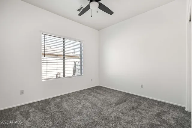an aerial view of residential houses with outdoor space and lake view